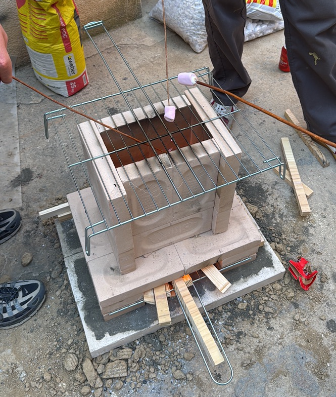 simple brick rocket stove making marshmallows